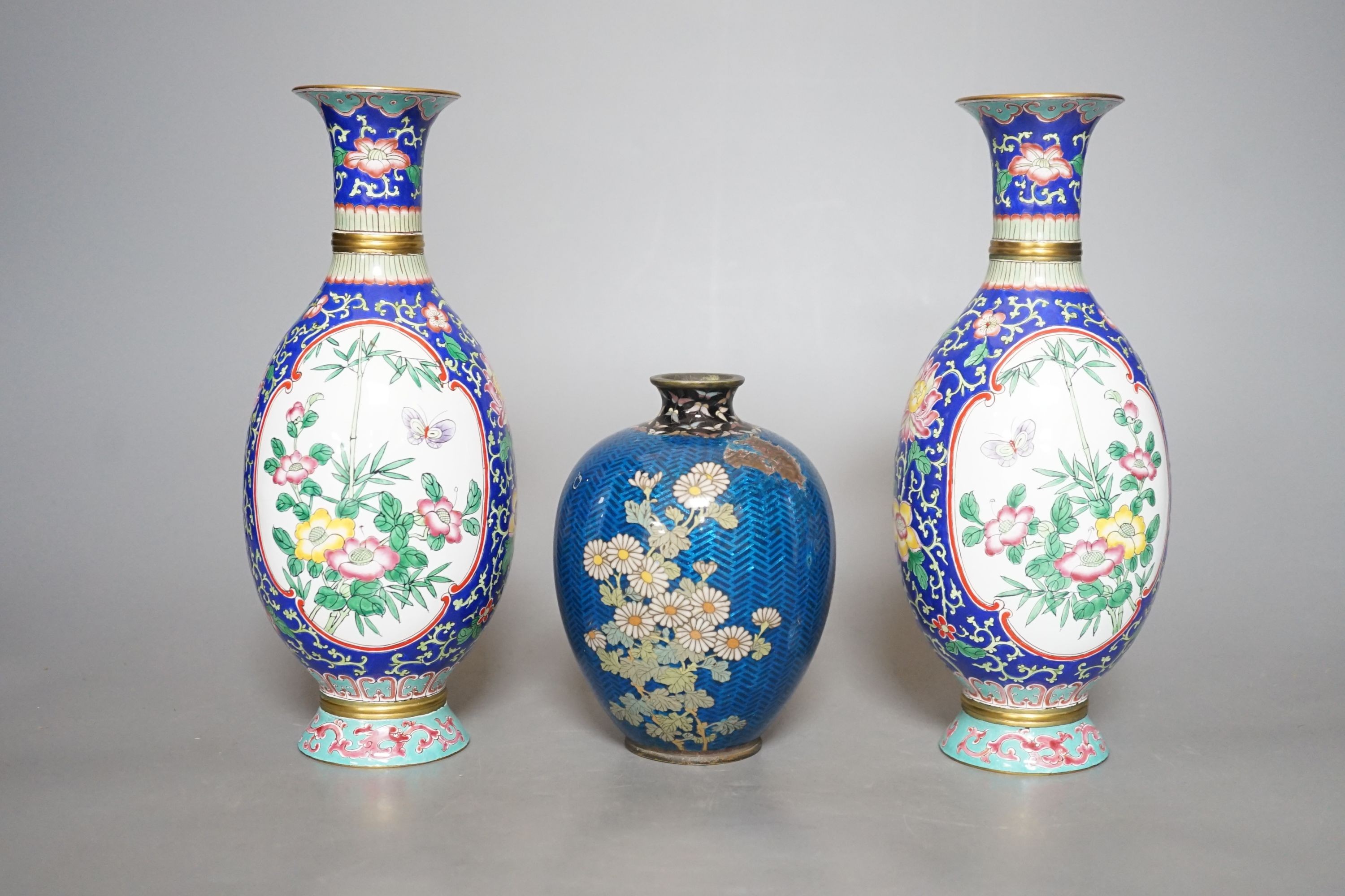 A Japanese floral cloisonné enamel vase, 13cm tall, together with two Canton enamel vases